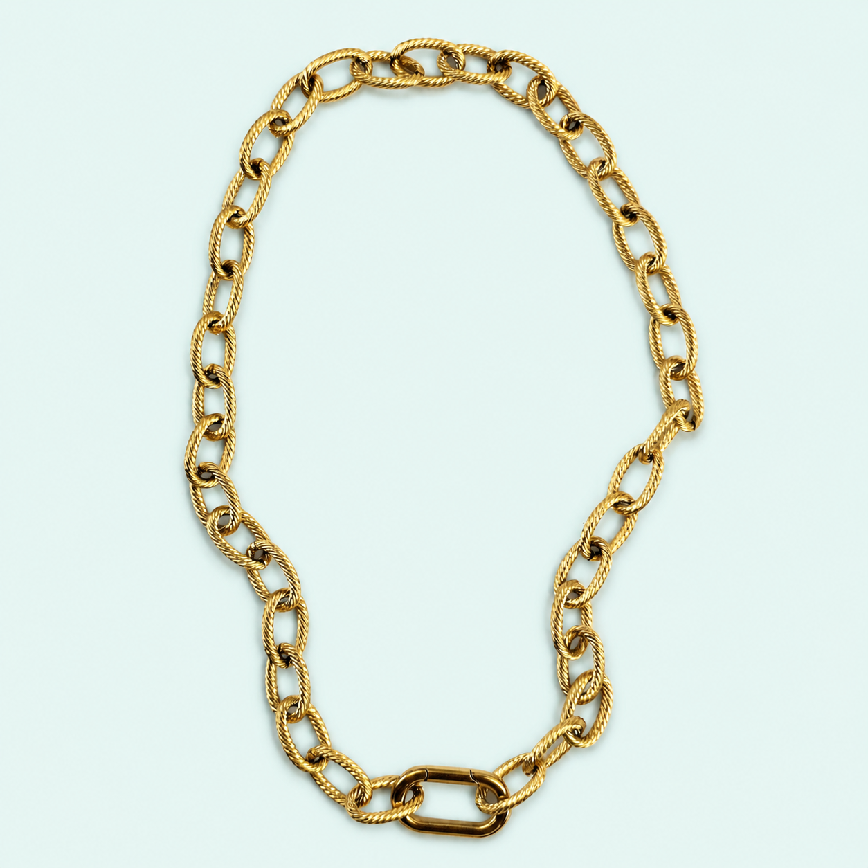 Close-up of a textured gold link necklace